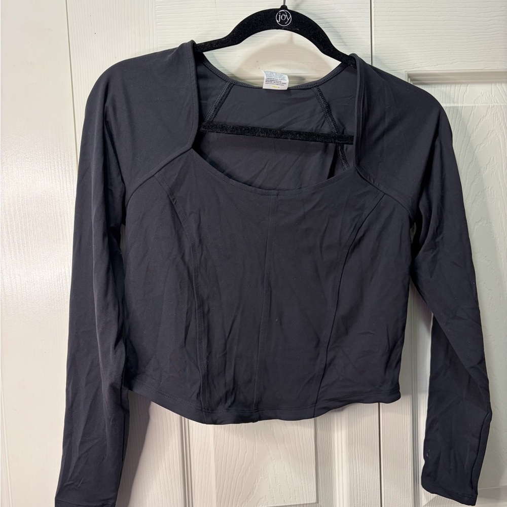 black long sleeve top with cut out detail. Size M
